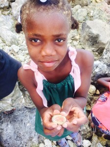 This is Angelika proudly showing me the "koule woch" we happened upon on our walk. We help Angelika go to school. I am concerned about her health because her hair is so orange. This is a sign of lots of malnourishment. 