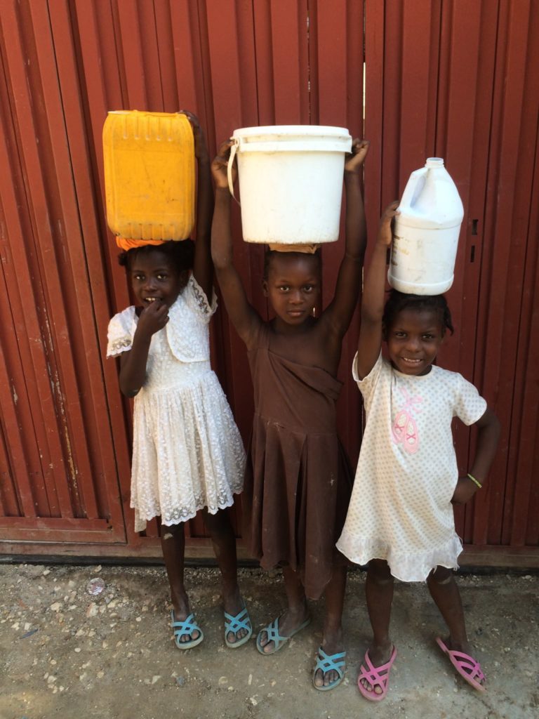 Medical-Girls with water bottles on heads